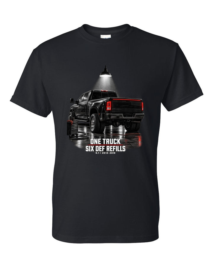 Ram 3500 4th gen dually 6.7 in a night garage with the text One truck, six DEF refills black t-shirt front view with the design