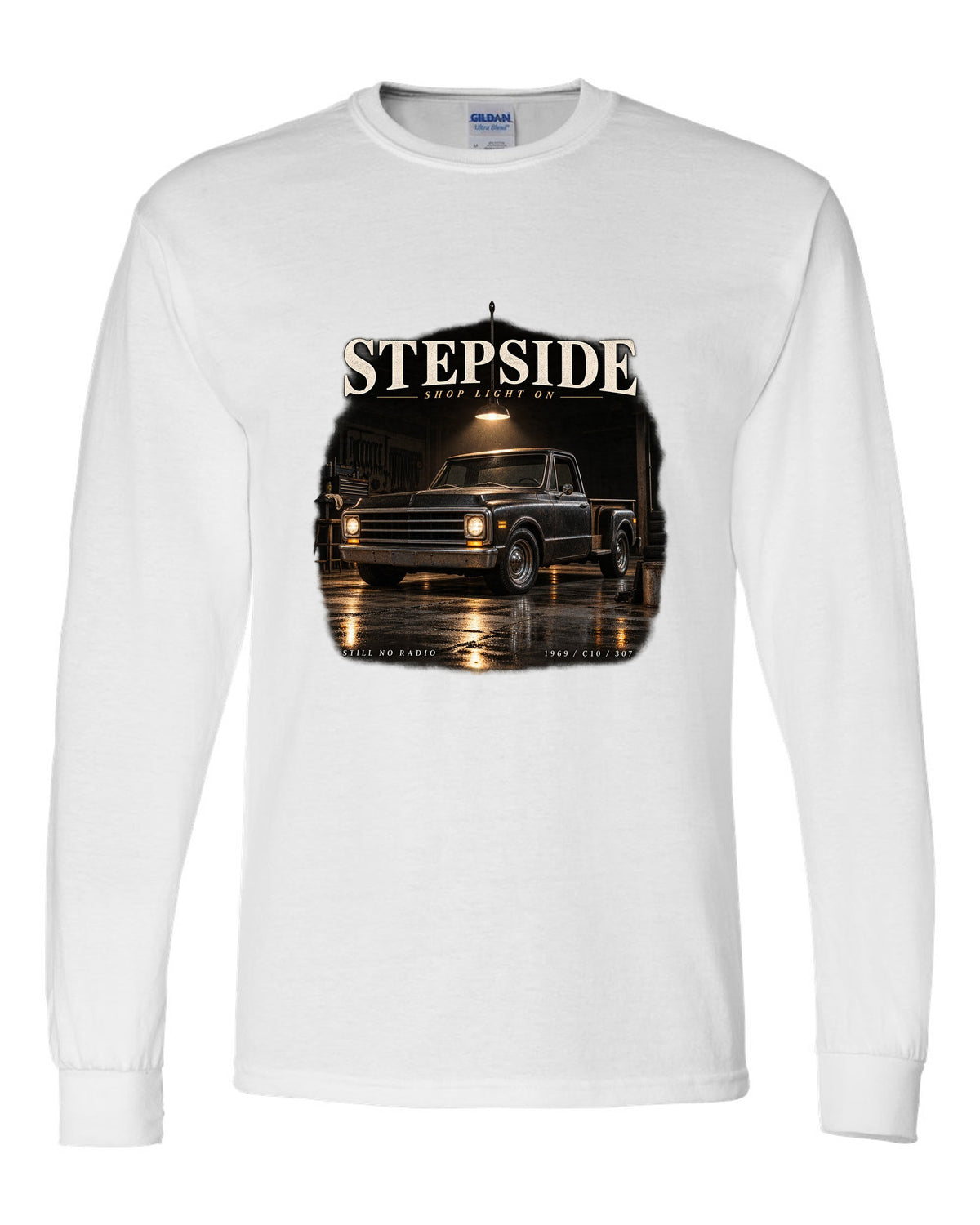 Chevy C10 Stepside under a shop light, garage night print white long sleeve front view with the design