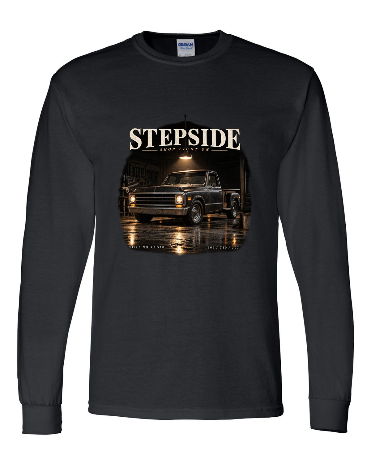 Chevy C10 Stepside under a shop light, garage night print black long sleeve front view with the design