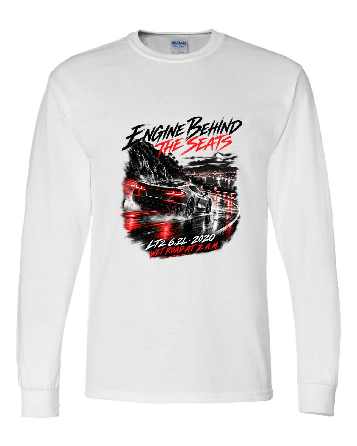 Corvette C8 Stingray driving on a wet road at night white long sleeve front view with the design