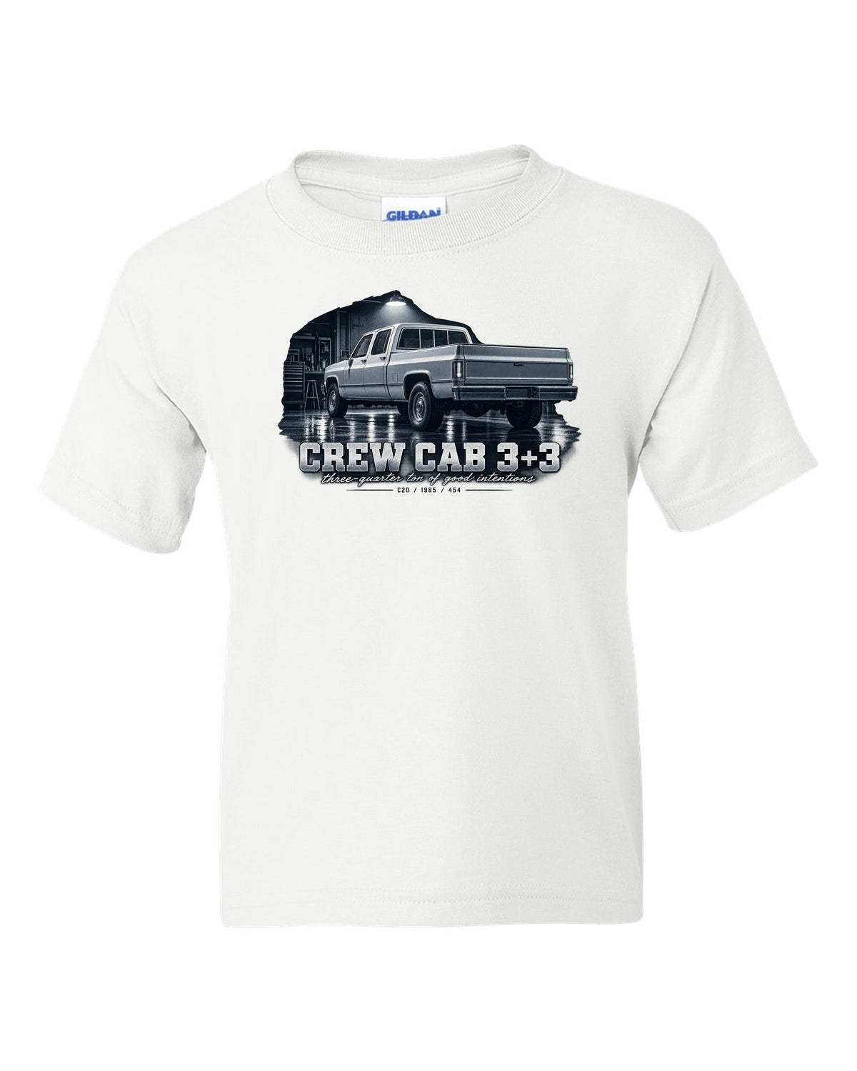 1985 C20 Squarebody crew cab in a garage night scene, print white kids tee front view with the design