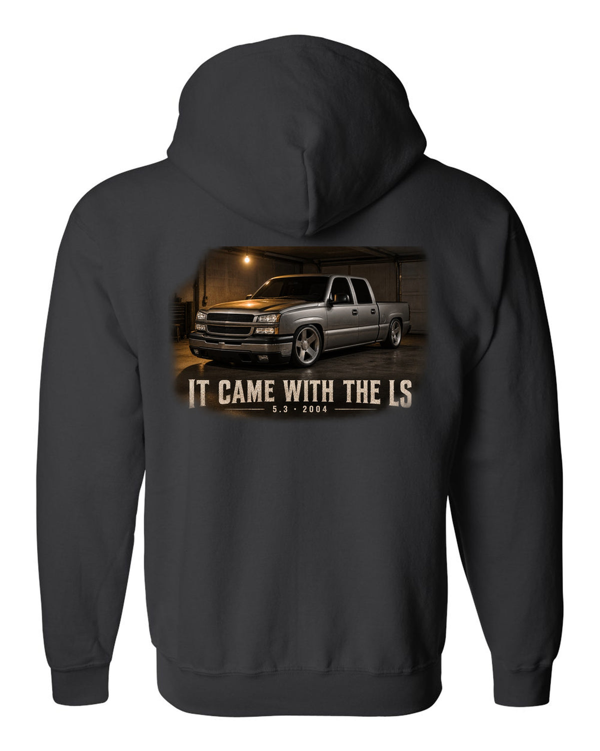 2004 Chevy Silverado crew cab in a garage night scene, print black zip hoodie back view with the design