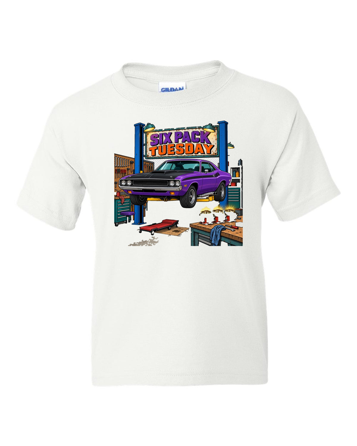 Garage workshop scene with a 1970 Dodge Challenger T/A on a lift and Six Pack Tuesday text white kids tee front view with the design