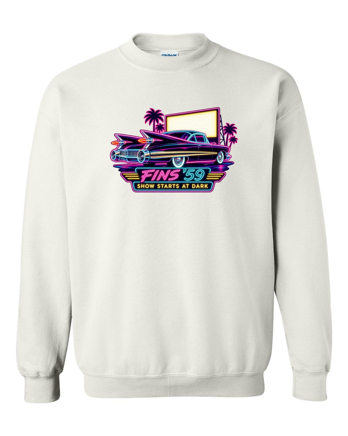 1959 Cadillac Coupe de Ville under neon sign glow at a night drive-in white crewneck front view with the design