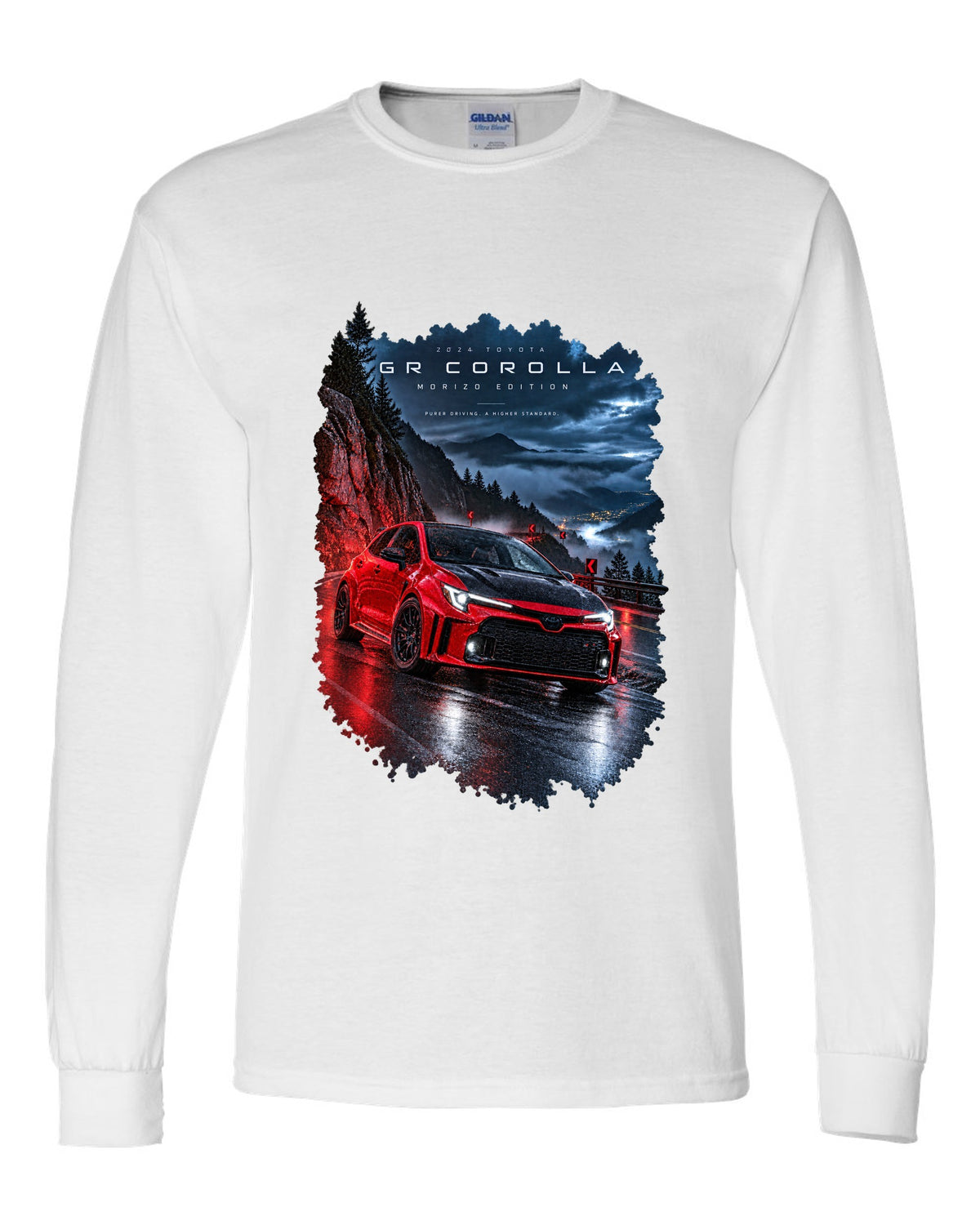Toyota GR Corolla Morizo Edition on a wet mountain road at night white long sleeve front view with the design