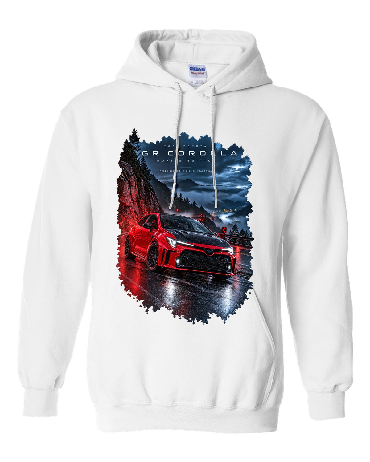 Toyota GR Corolla Morizo Edition on a wet mountain road at night white pull over hoodie front view with the design