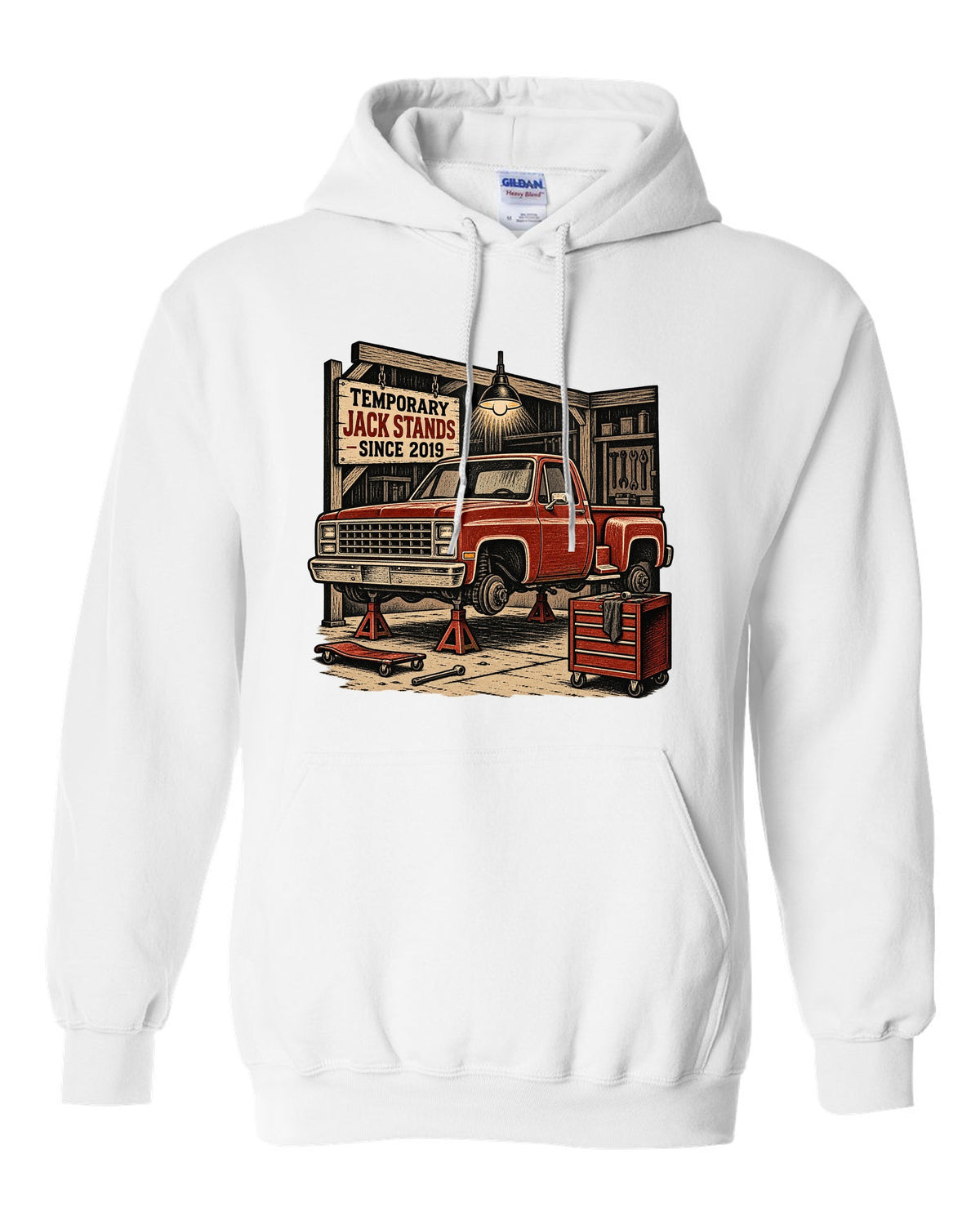 Linocut woodcut style print of a 1973-87 Chevrolet C10 Squarebody Stepside in a workshop with jack stands lettering white pull over hoodie front view with the design