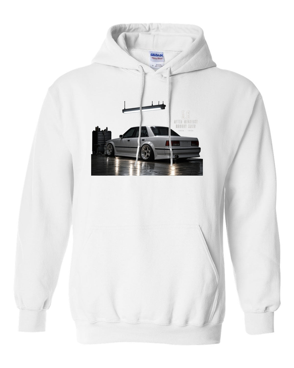 print of a Mercedes W124 300E 5.6 Hammer in a night garage with the text 5.6 After Midnight Nobody Knew white pull over hoodie front view with the design