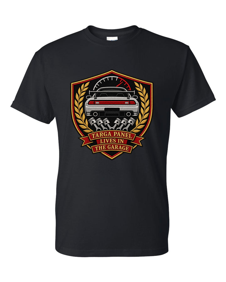 Embroidery-style shield crest print for the Toyota Supra A80 with targa panel lives in the garage lettering black t-shirt front view with the design