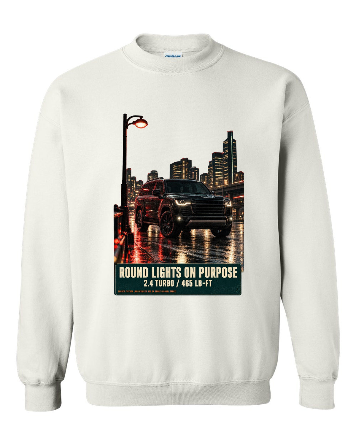 Toyota Land Cruiser 250 First Edition on a mountain pass at night white crewneck front view with the design