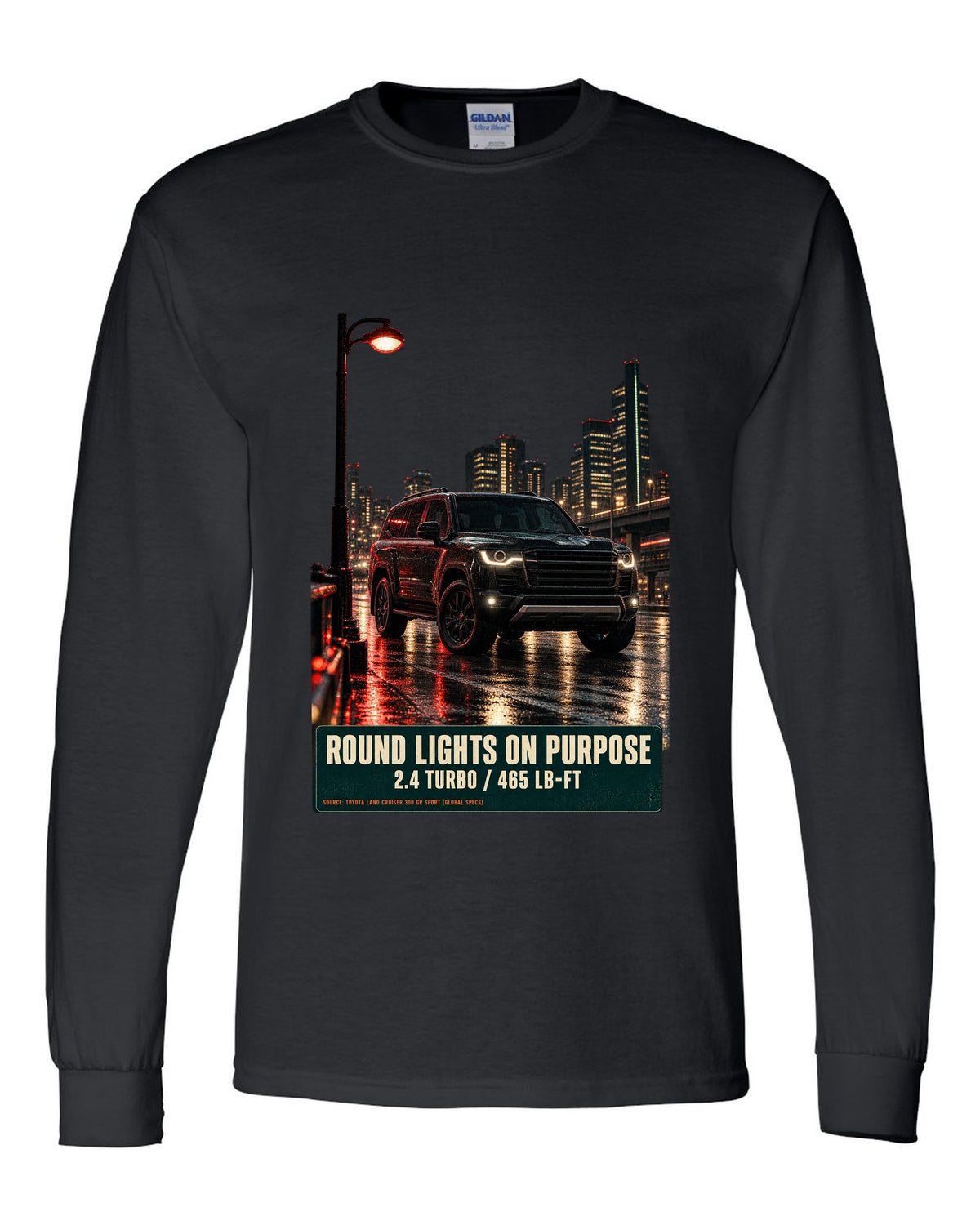 Toyota Land Cruiser 250 First Edition on a mountain pass at night black long sleeve front view with the design