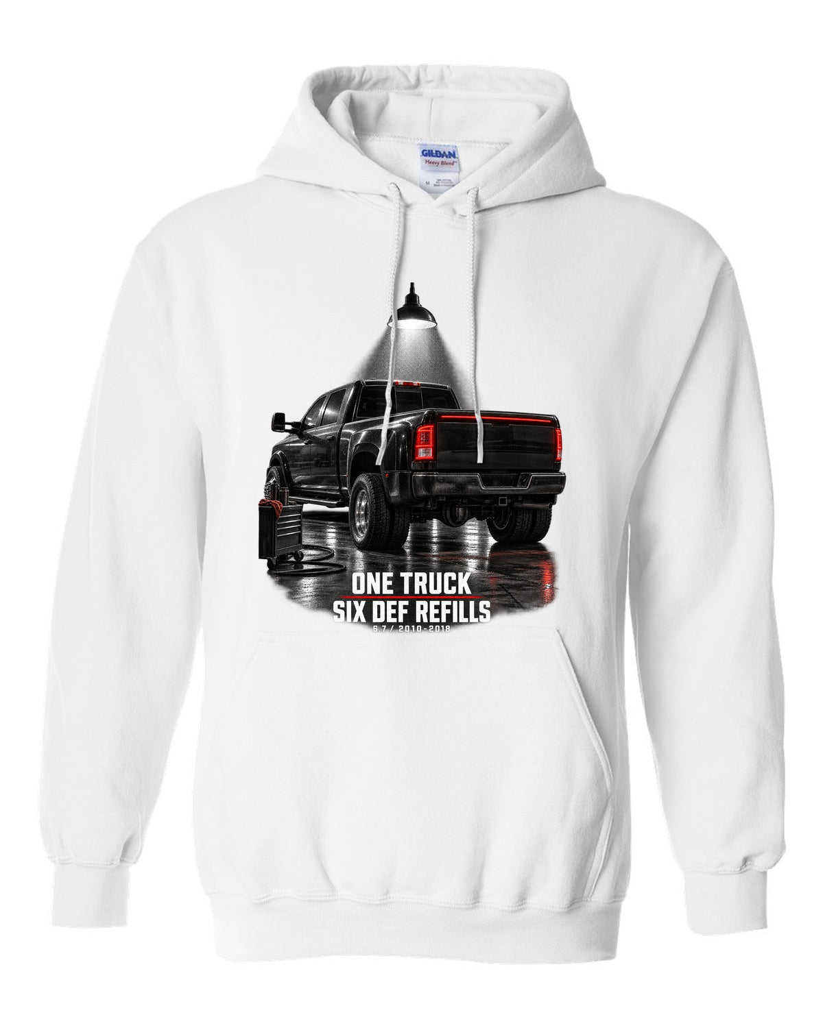 Ram 3500 4th gen dually 6.7 in a night garage with the text One truck, six DEF refills white pull over hoodie front view with the design