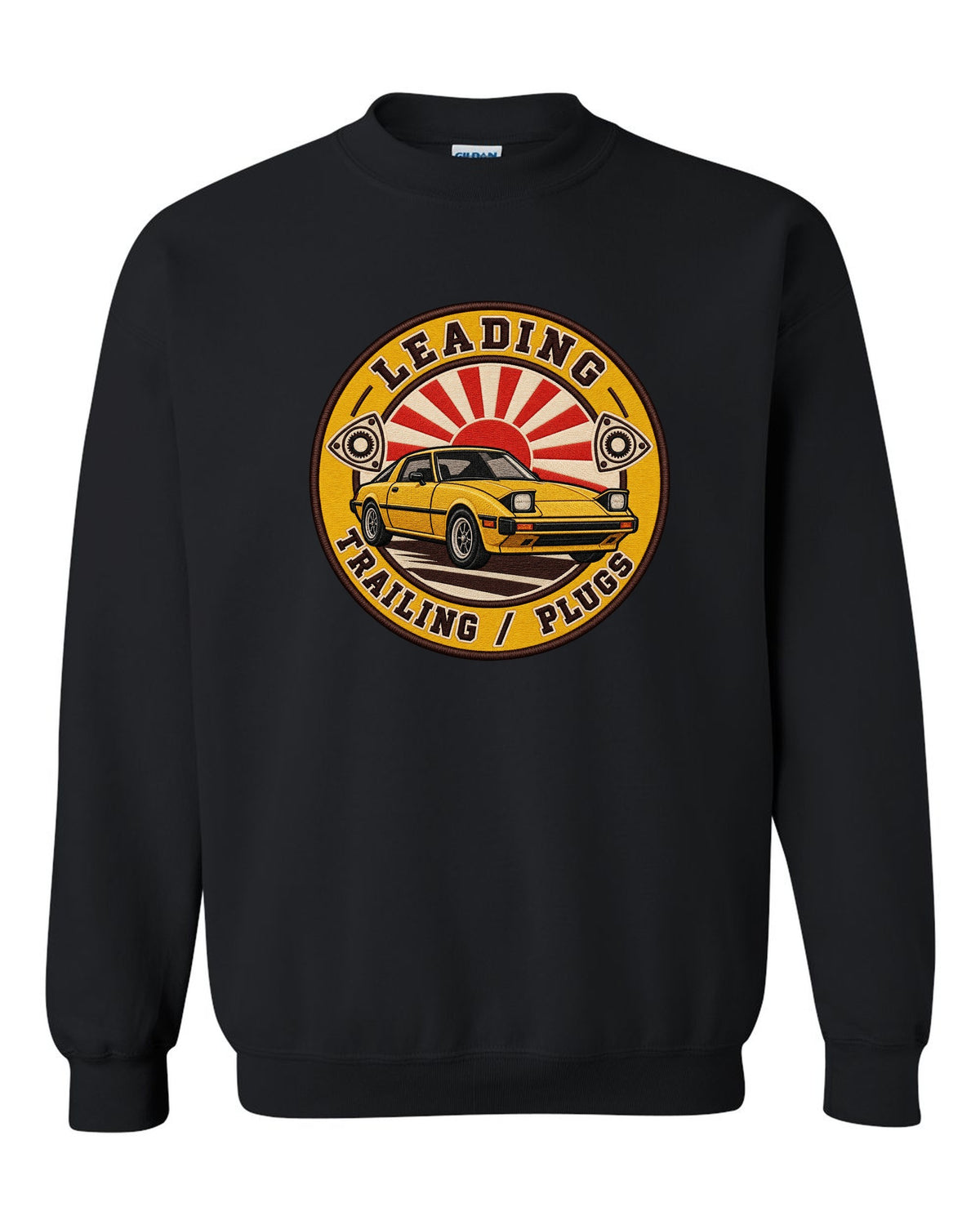 Embroidery-style roundel crest of a Mazda RX-7 SA22C with rotary plug text black crewneck front view with the design