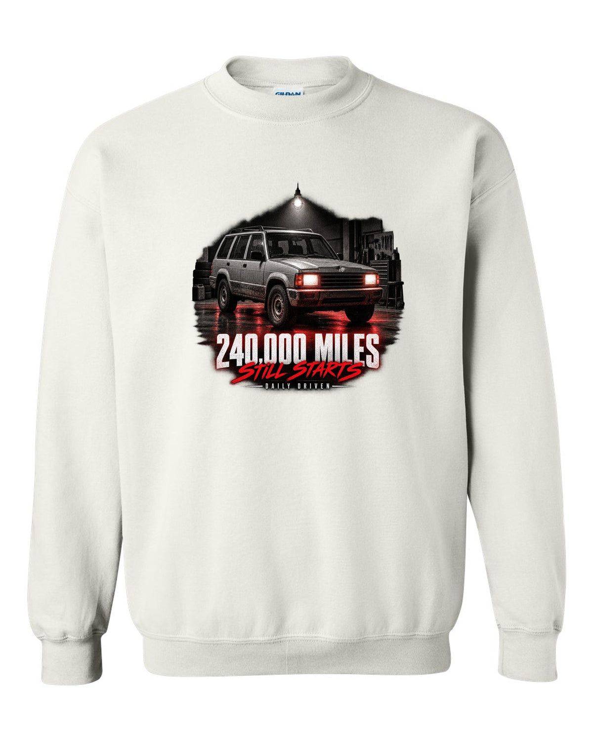 Jeep Cherokee XJ at night with daily driven 240,000 miles print white crewneck front view with the design