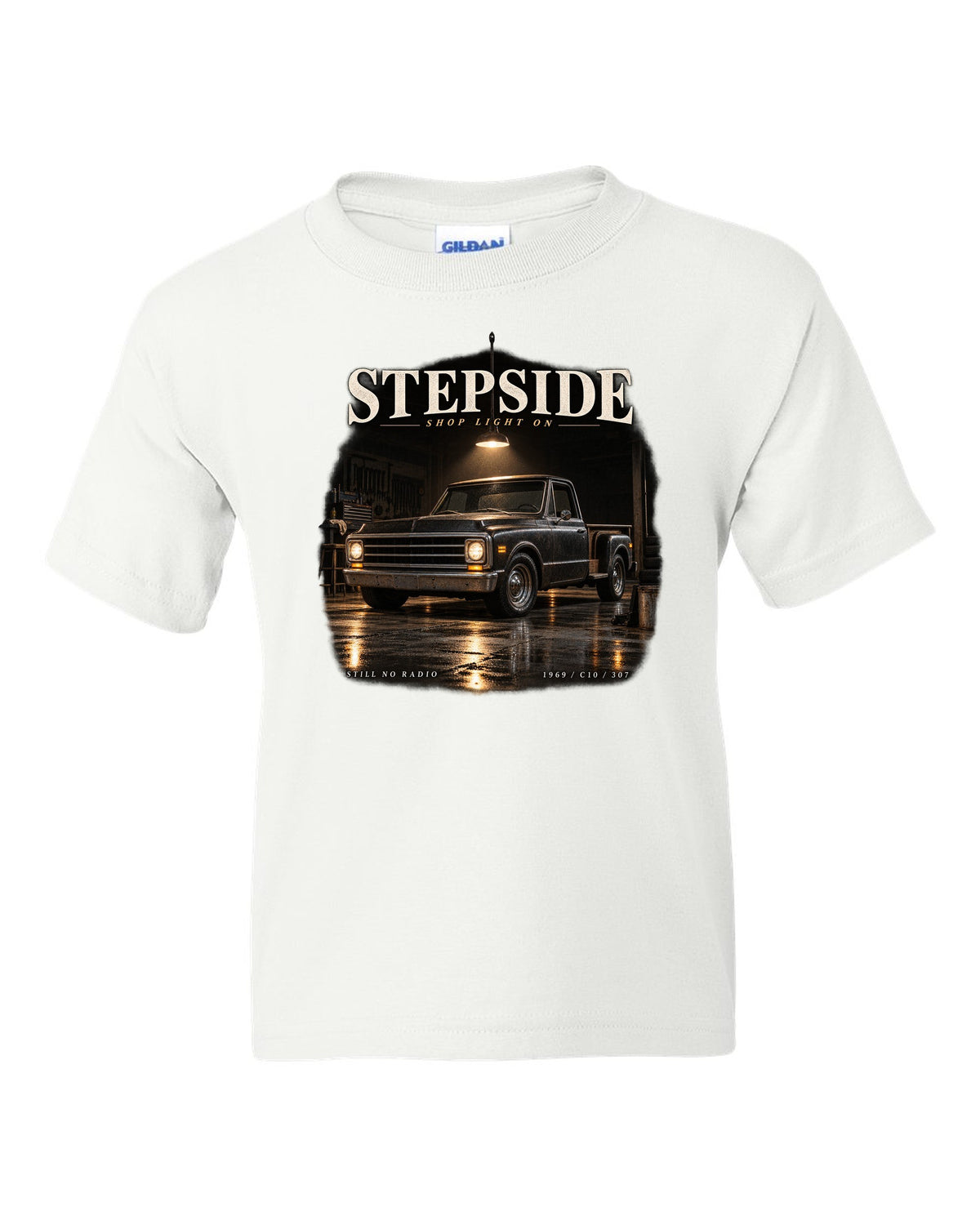 Chevy C10 Stepside under a shop light, garage night print white kids tee front view with the design