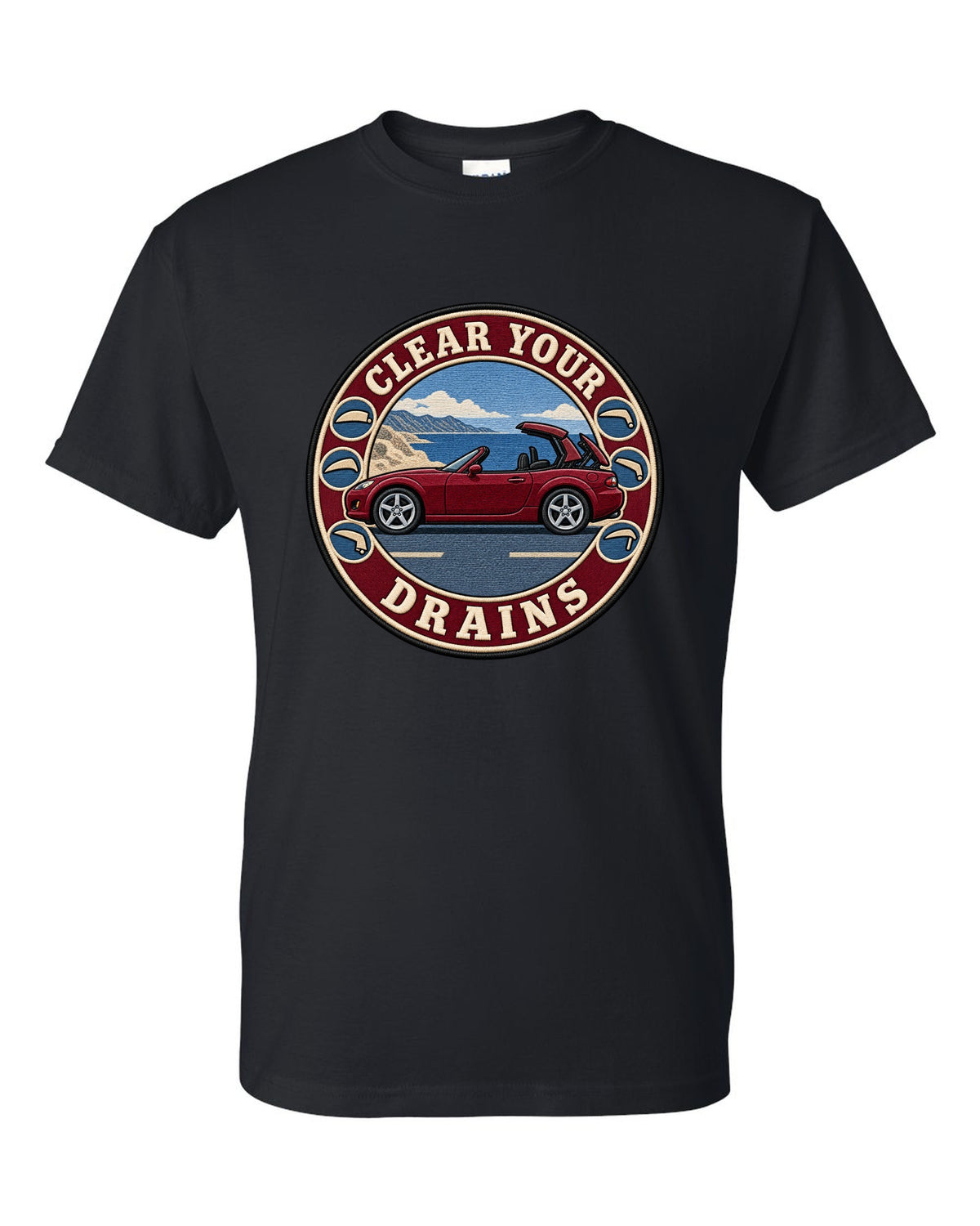 Embroidery-style roundel crest of a Mazda MX-5 NC with clear your drains text black t-shirt front view with the design