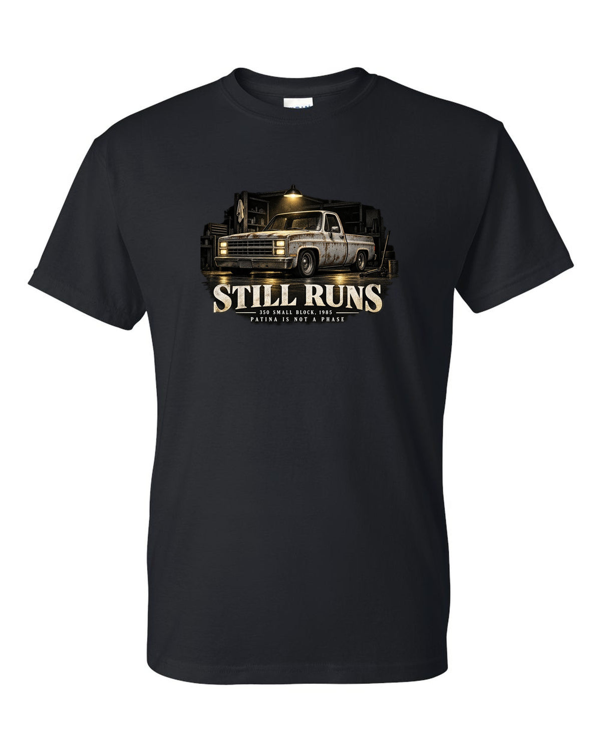 Night garage print of a 1973-87 Chevrolet C10 Squarebody with 350 small block text black t-shirt front view with the design