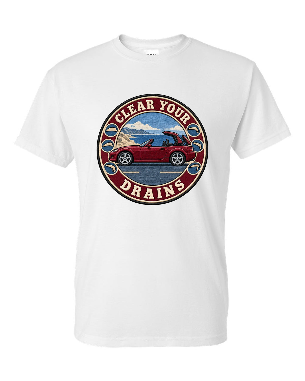 Embroidery-style roundel crest of a Mazda MX-5 NC with clear your drains text white t-shirt front view with the design
