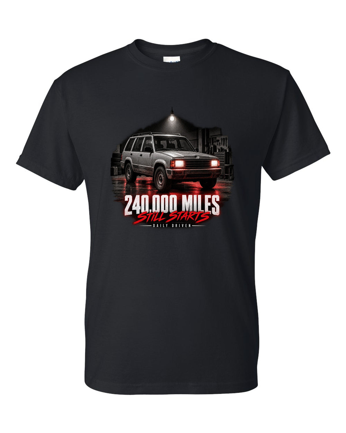 Jeep Cherokee XJ at night with daily driven 240,000 miles print black t-shirt front view with the design