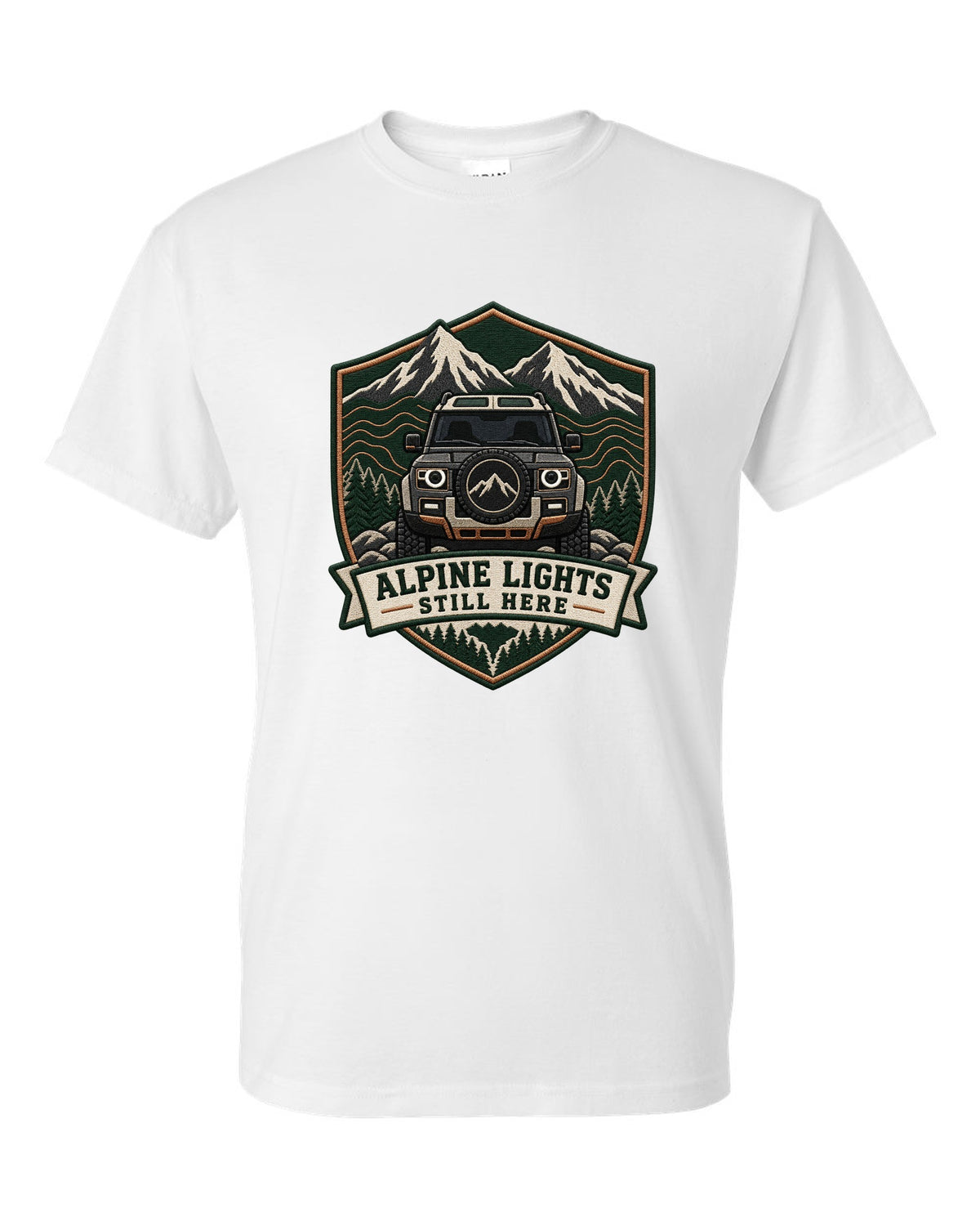 Original shield crest print for a Land Rover Defender L663 with Alpine Lights Still Here text white t-shirt front view with the design