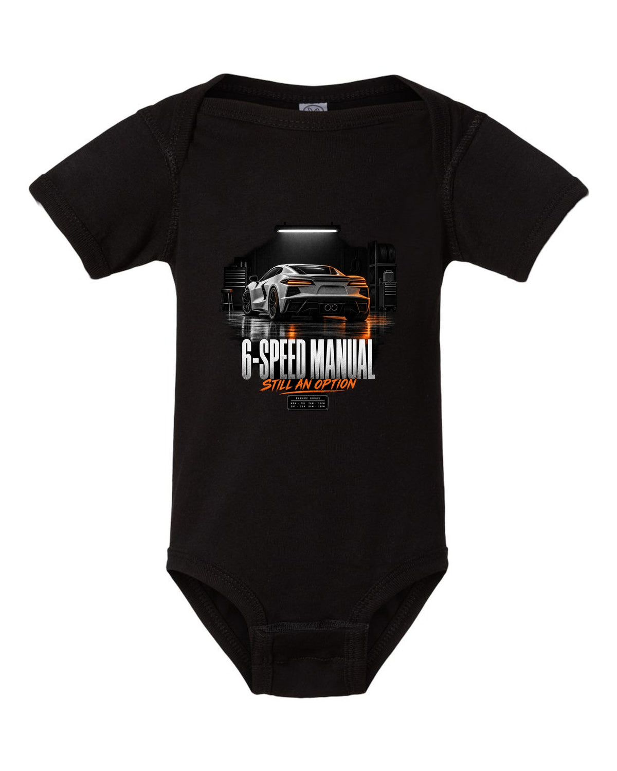 Lotus Emira V6 in a garage at night with 6-speed manual text black baby onesie front view with the design