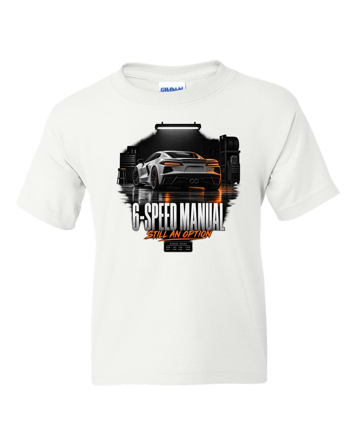 Lotus Emira V6 in a garage at night with 6-speed manual text white kids tee front view with the design