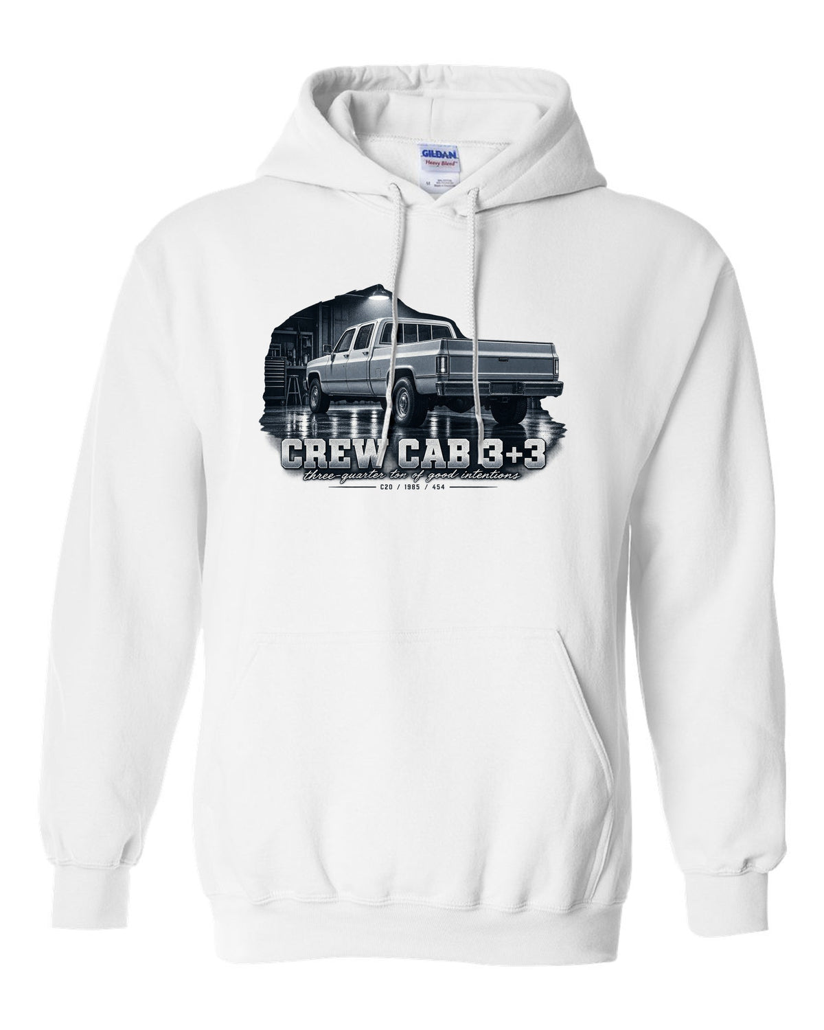 1985 C20 Squarebody crew cab in a garage night scene, print white pull over hoodie front view with the design