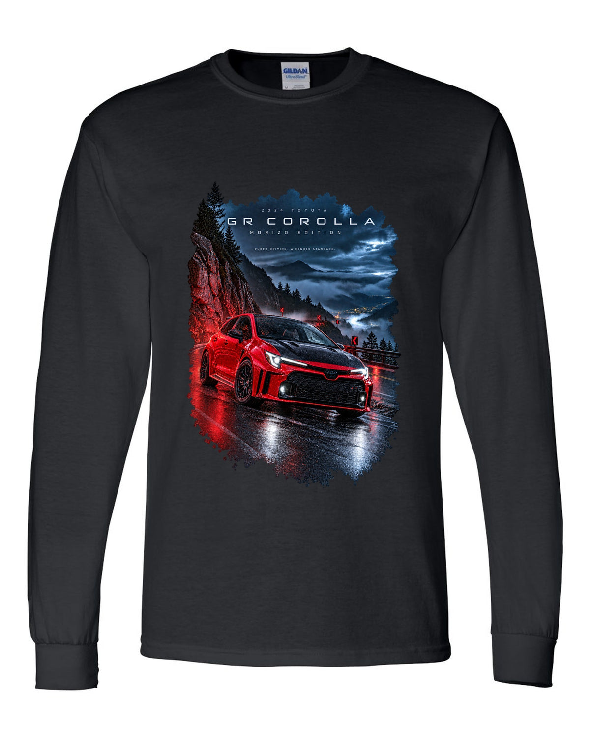Toyota GR Corolla Morizo Edition on a wet mountain road at night black long sleeve front view with the design