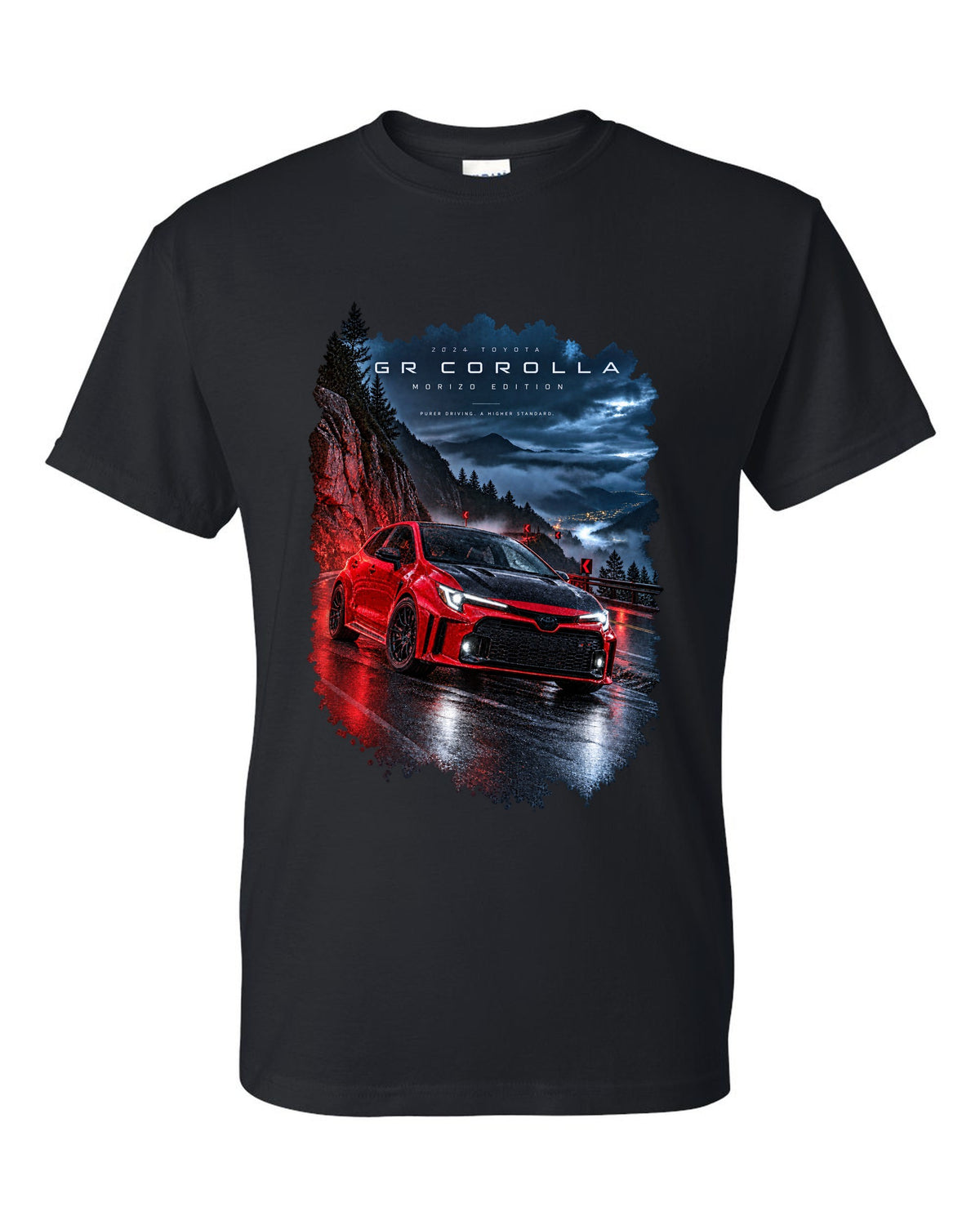 Toyota GR Corolla Morizo Edition on a wet mountain road at night black t-shirt front view with the design
