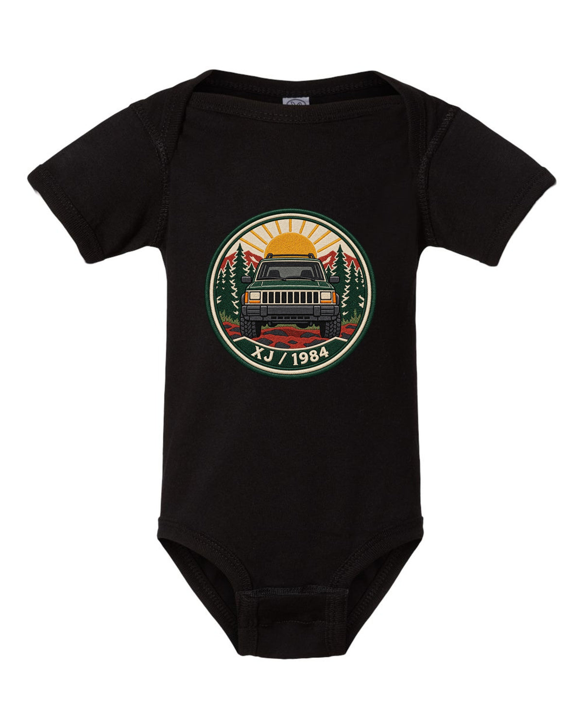 Round embroidered-style crest print of a boxy Jeep Cherokee XJ with XJ 1984 text black baby onesie front view with the design