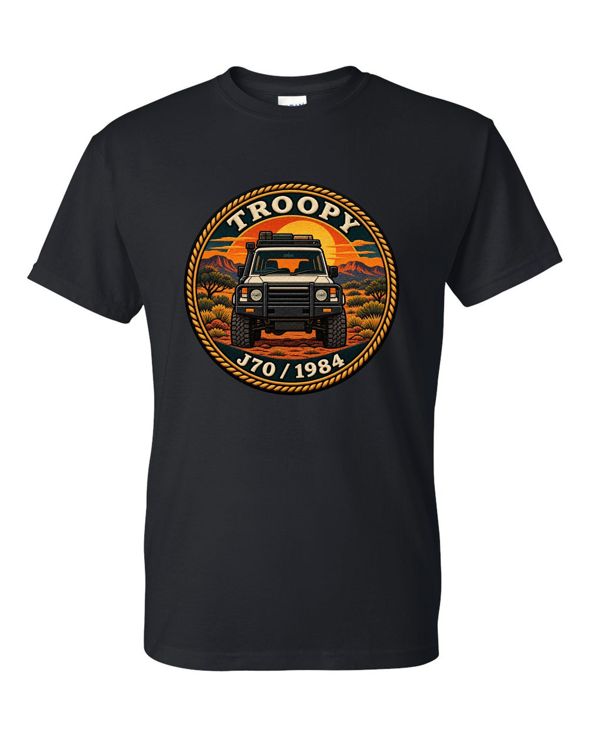 Sunset stamp patch crest of a Toyota Land Cruiser J70 troop carrier with the word Troopy black t-shirt front view with the design