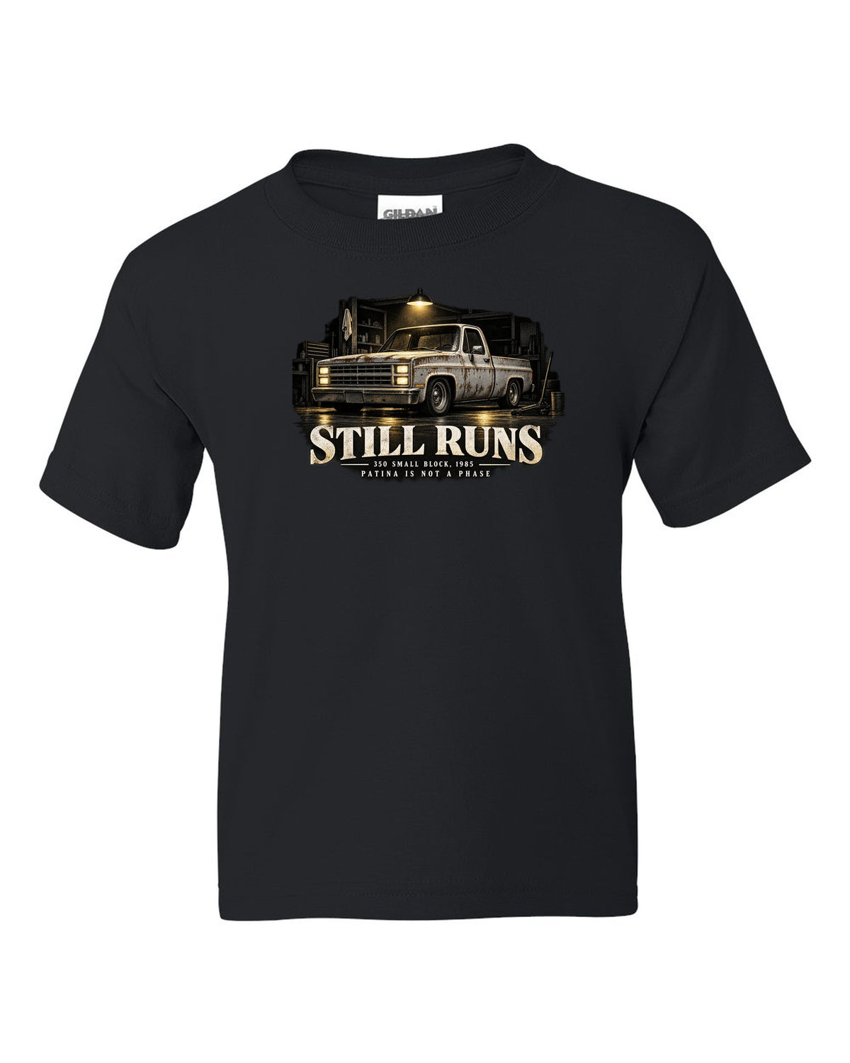 Night garage print of a 1973-87 Chevrolet C10 Squarebody with 350 small block text black kids tee front view with the design