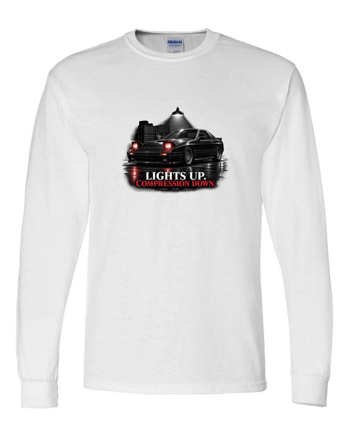 Low front three-quarter Mazda RX-7 FC3S Turbo II in a garage at night white long sleeve front view with the design