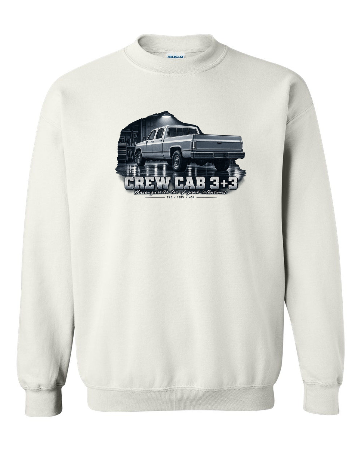 1985 C20 Squarebody crew cab in a garage night scene, print white crewneck front view with the design