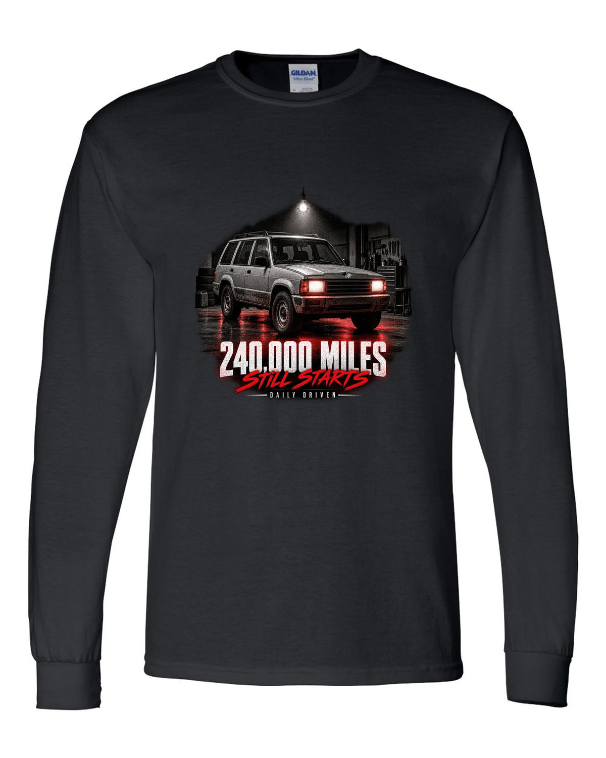Jeep Cherokee XJ at night with daily driven 240,000 miles print black long sleeve front view with the design