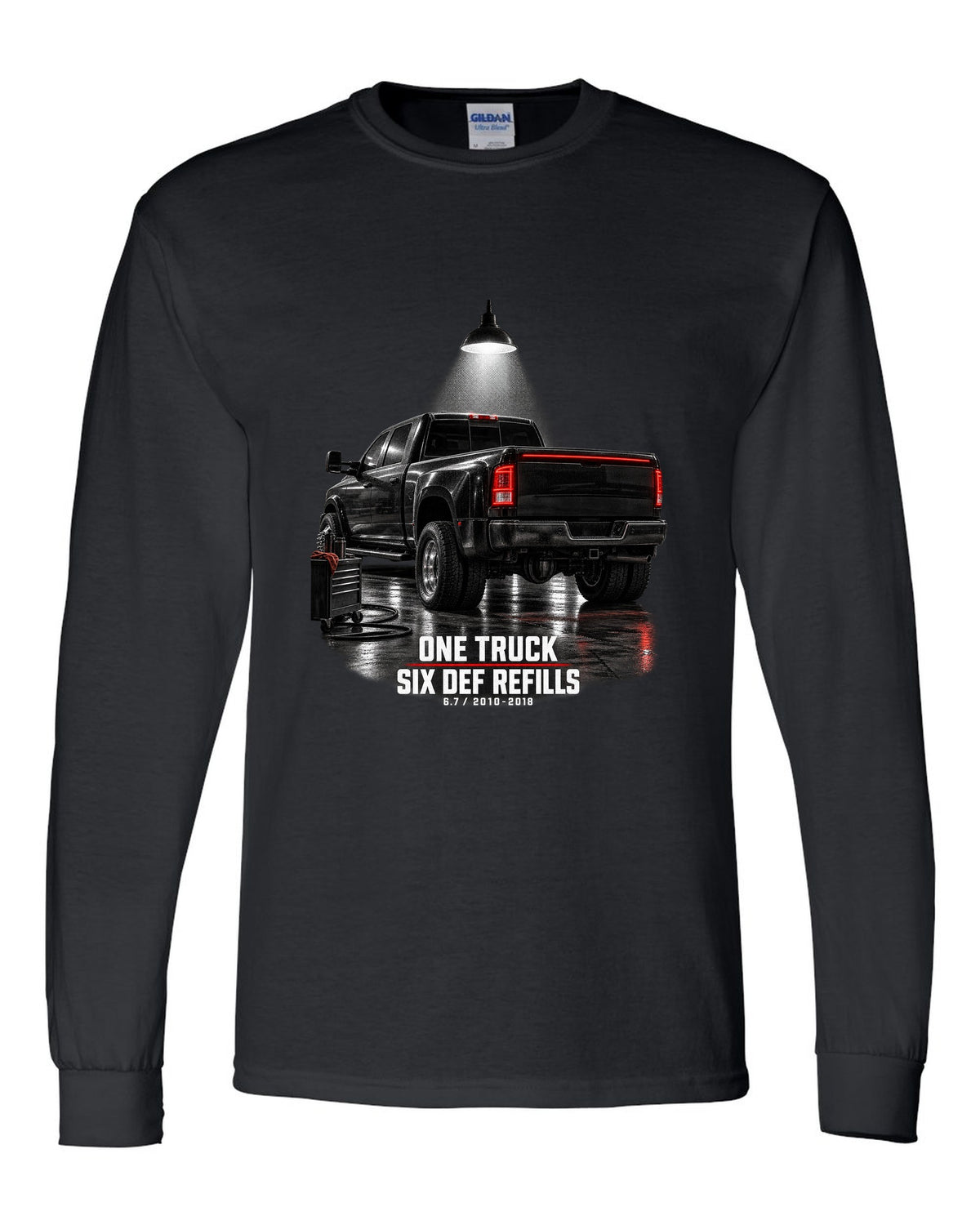 Ram 3500 4th gen dually 6.7 in a night garage with the text One truck, six DEF refills black long sleeve front view with the design