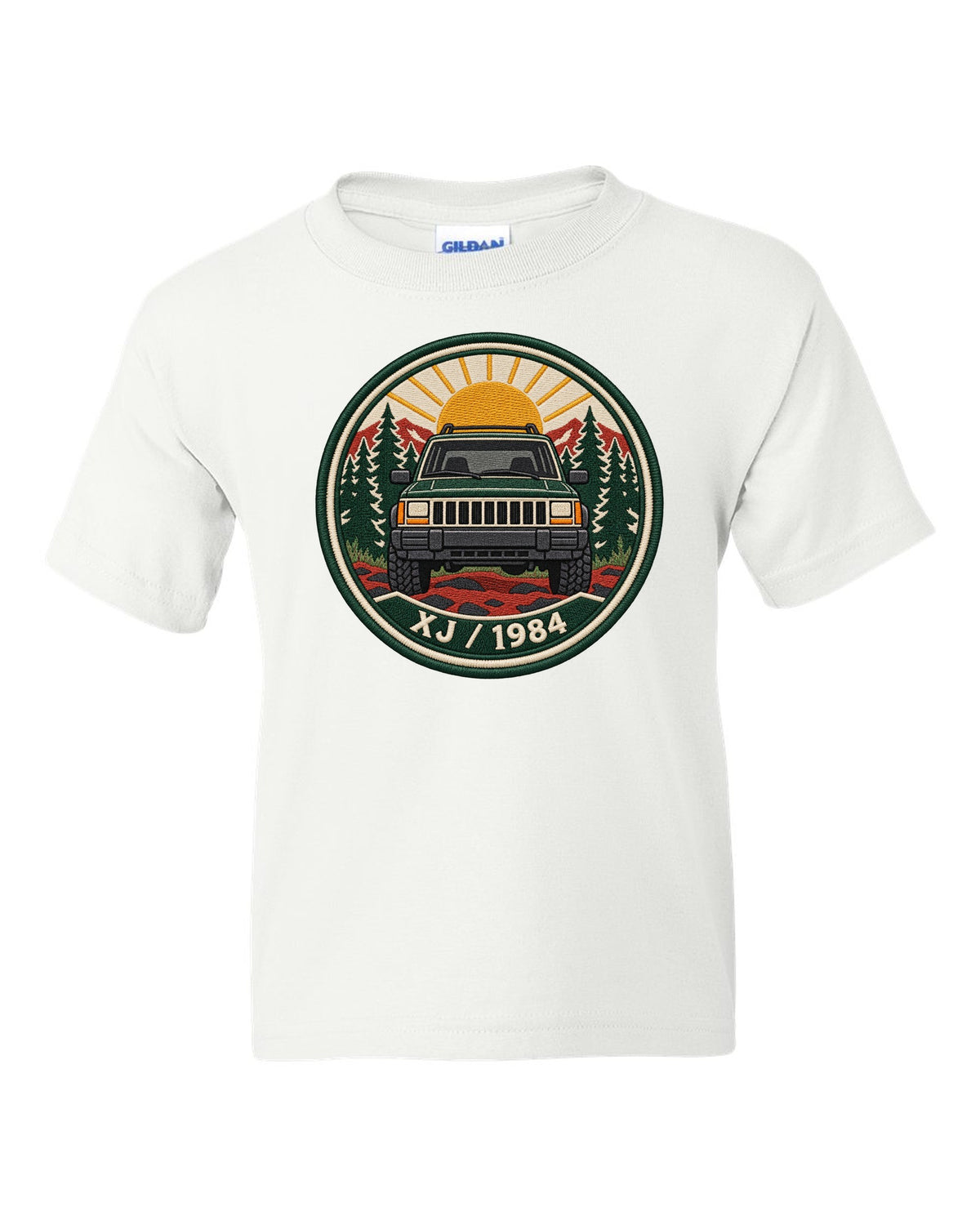 Round embroidered-style crest print of a boxy Jeep Cherokee XJ with XJ 1984 text white kids tee front view with the design