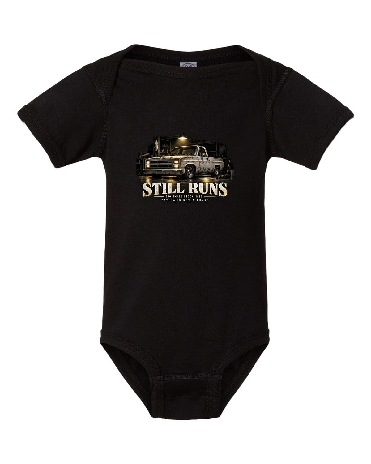 Night garage print of a 1973-87 Chevrolet C10 Squarebody with 350 small block text black baby onesie front view with the design