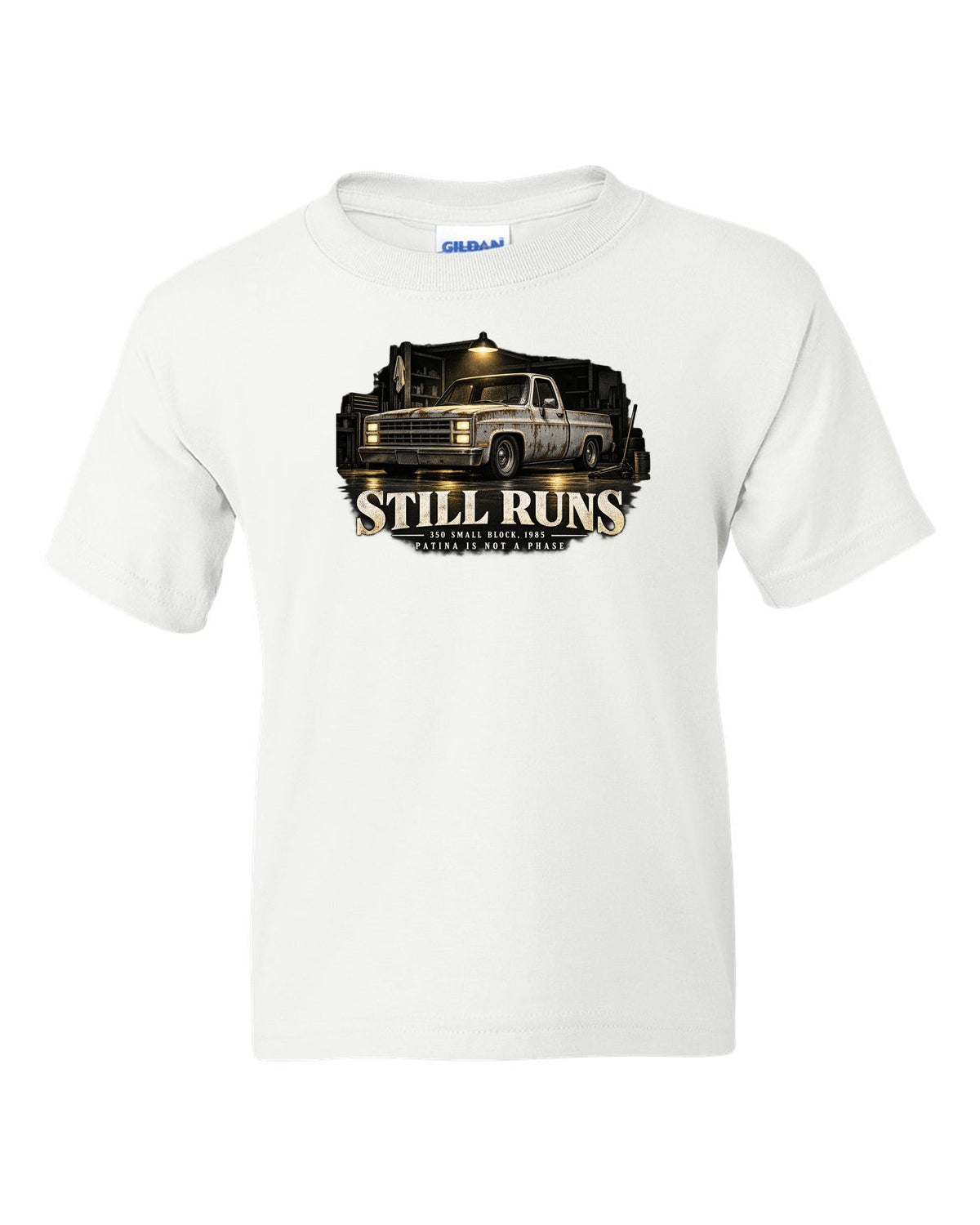 Night garage print of a 1973-87 Chevrolet C10 Squarebody with 350 small block text white kids tee front view with the design