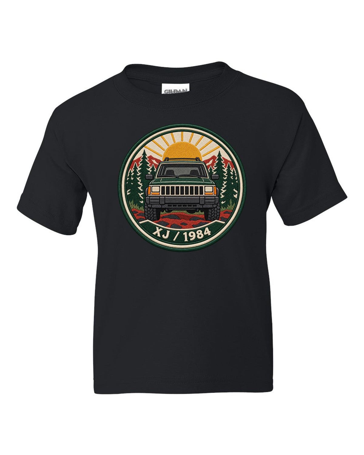 Round embroidered-style crest print of a boxy Jeep Cherokee XJ with XJ 1984 text black kids tee front view with the design