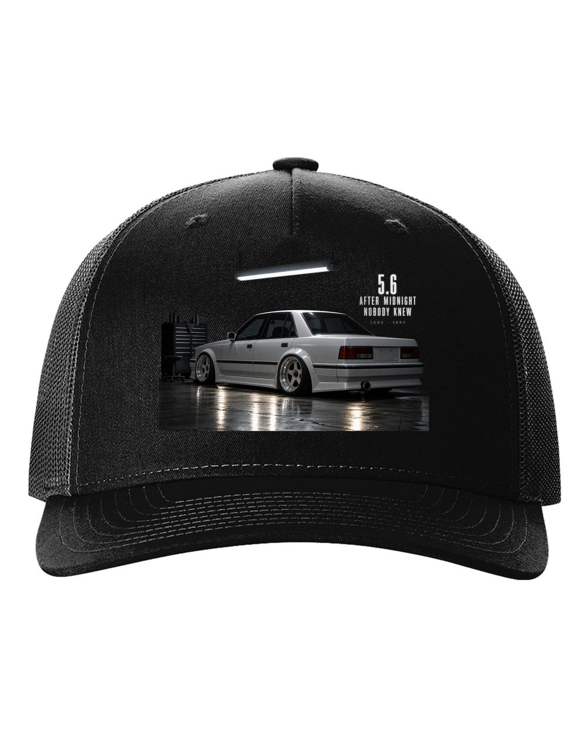 print of a Mercedes W124 300E 5.6 Hammer in a night garage with the text 5.6 After Midnight Nobody Knew black hat front view with the design