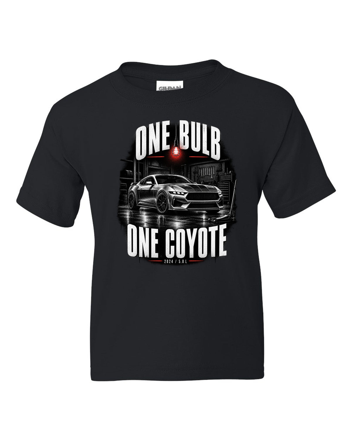 Ford Mustang S650 GT coupe in a dimly lit garage, one bulb one Coyote print black kids tee front view with the design