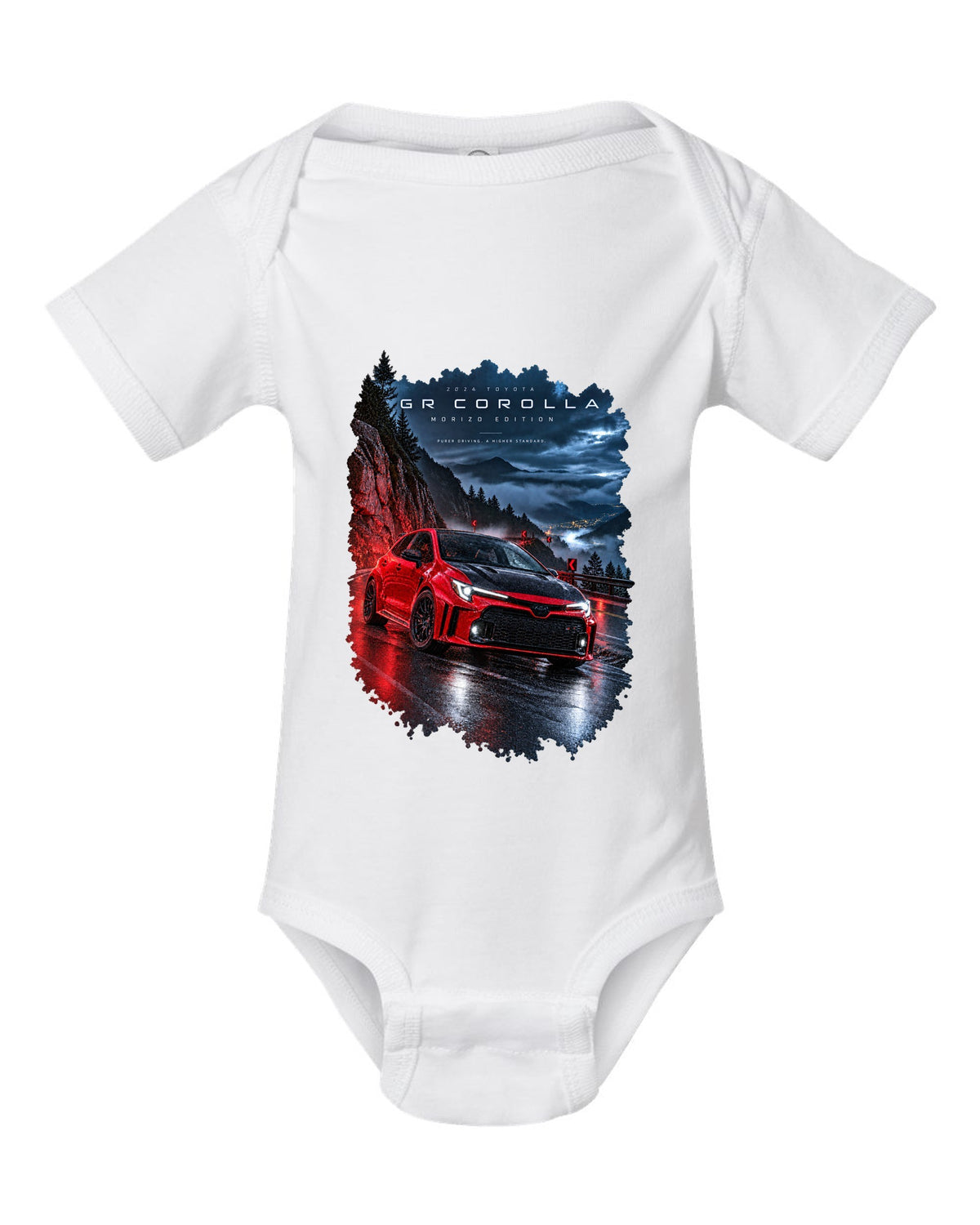 Toyota GR Corolla Morizo Edition on a wet mountain road at night white baby onesie front view with the design