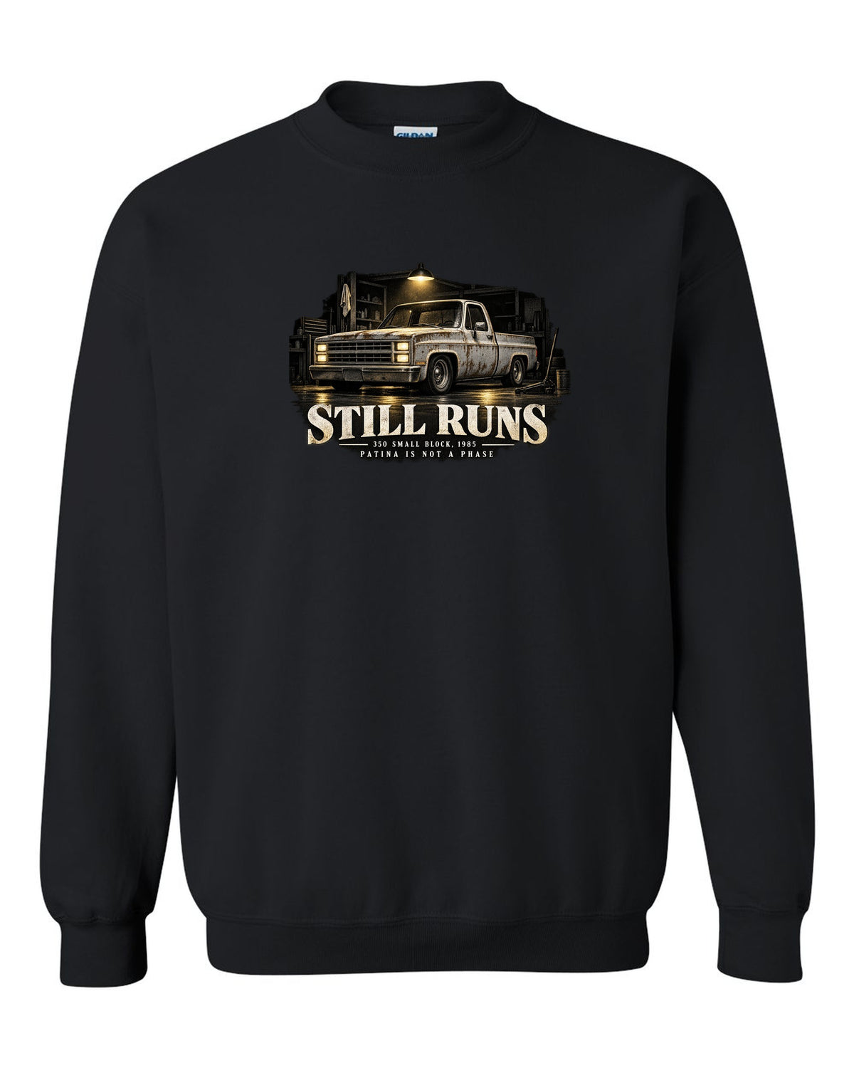 Night garage print of a 1973-87 Chevrolet C10 Squarebody with 350 small block text black crewneck front view with the design