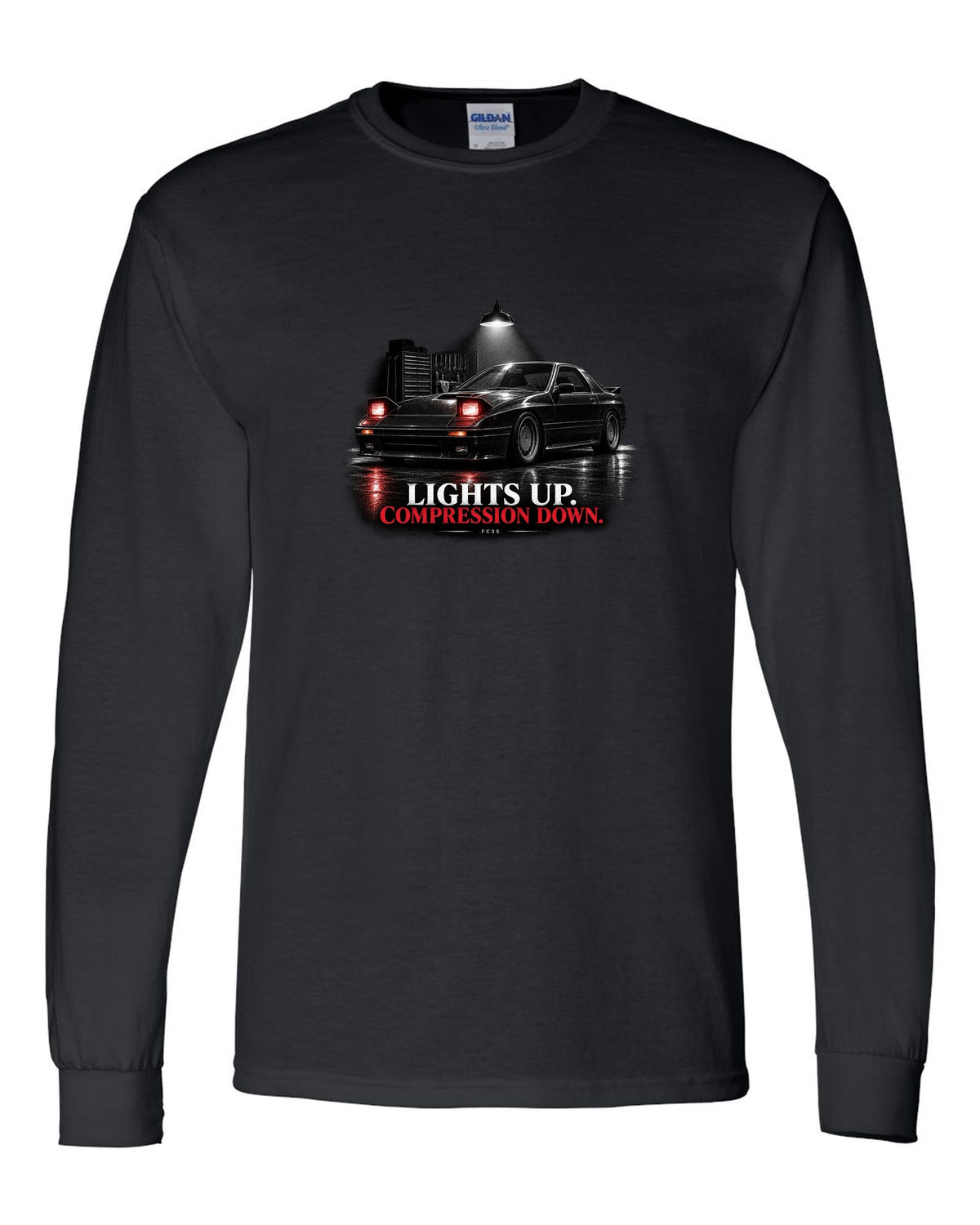 Low front three-quarter Mazda RX-7 FC3S Turbo II in a garage at night black long sleeve front view with the design