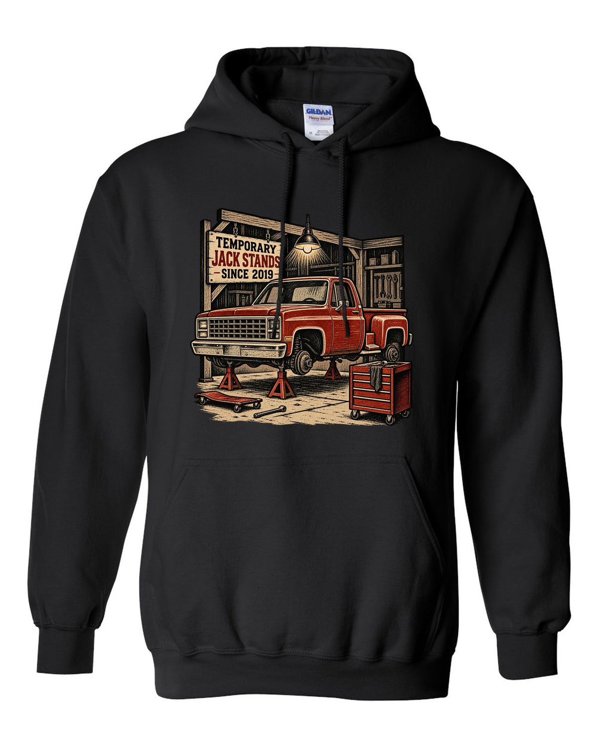 Linocut woodcut style print of a 1973-87 Chevrolet C10 Squarebody Stepside in a workshop with jack stands lettering black pull over hoodie front view with the design