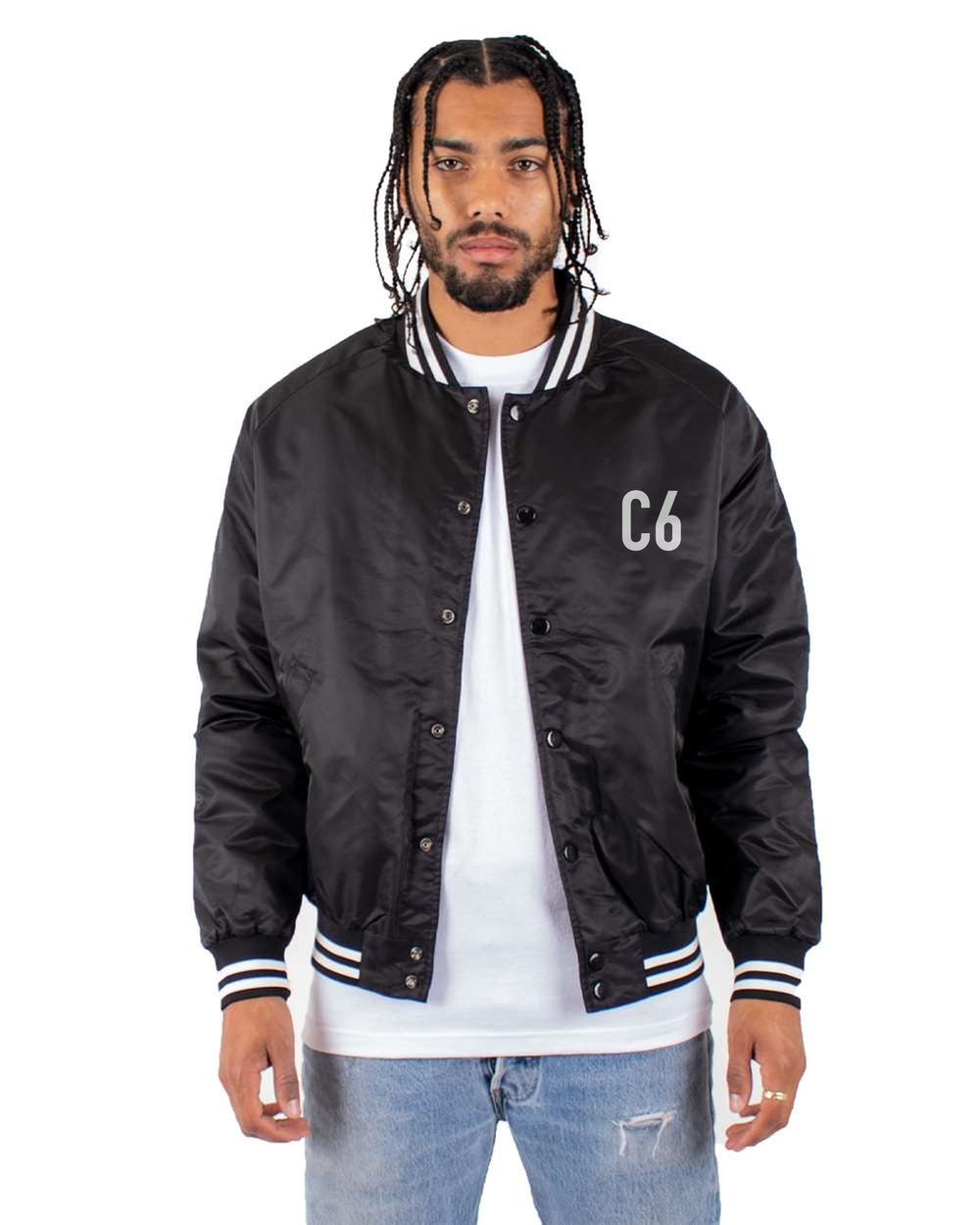 black bomber jacket front view with small code mark