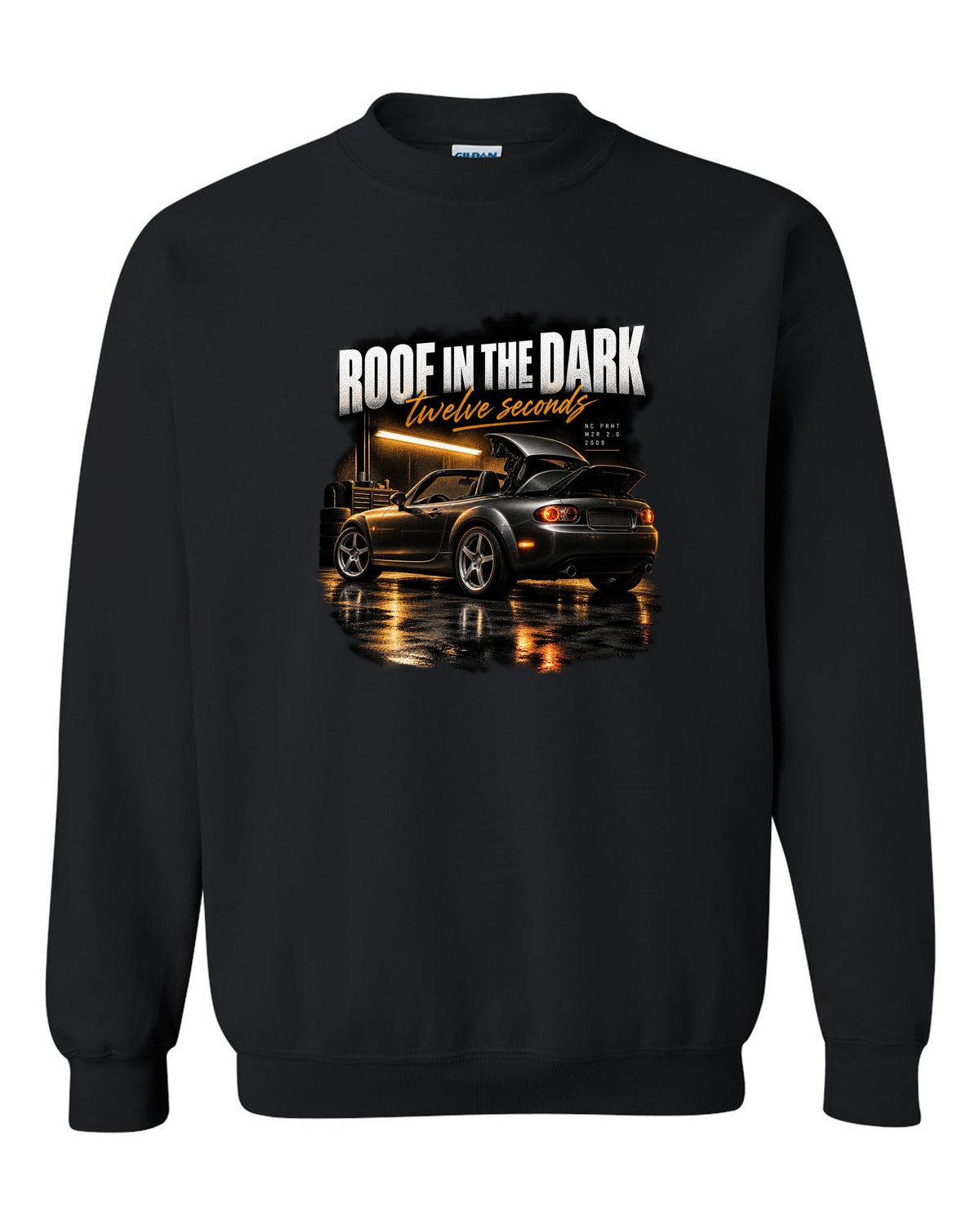 Garage night print of a Mazda MX-5 NC PRHT with the roof folding black crewneck front view with the design