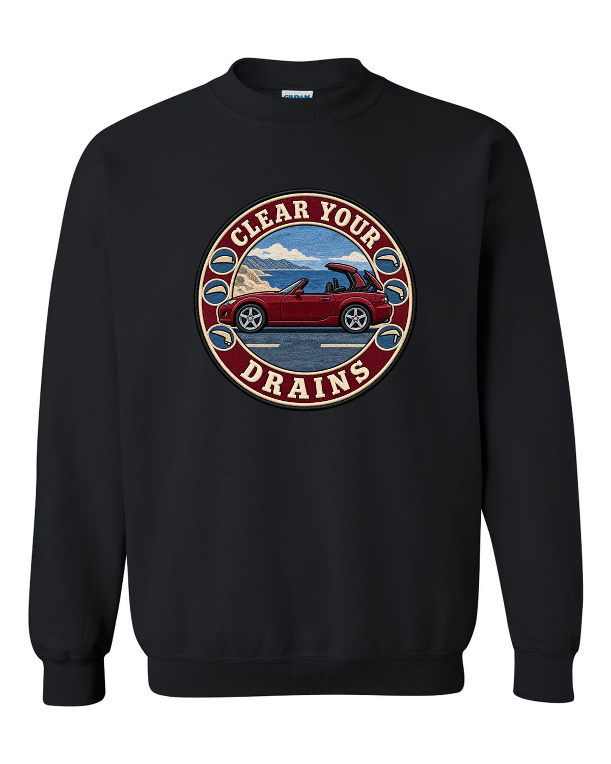 Embroidery-style roundel crest of a Mazda MX-5 NC with clear your drains text black crewneck front view with the design