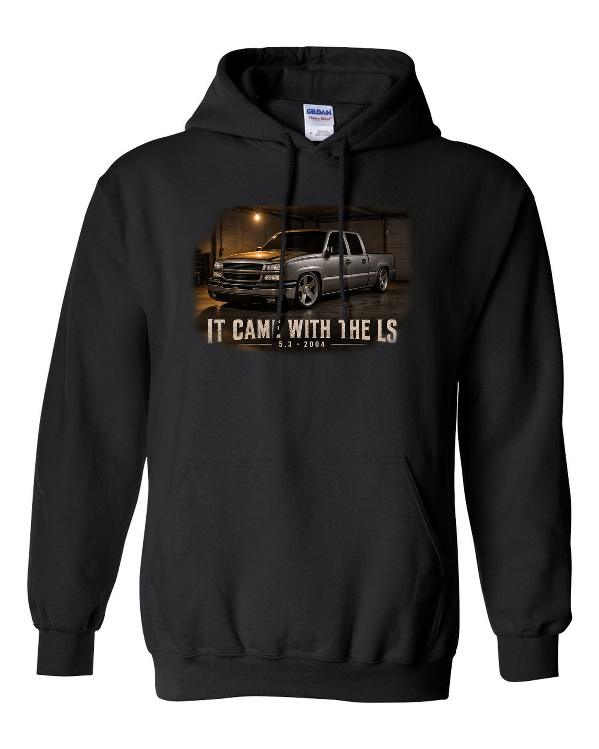 2004 Chevy Silverado crew cab in a garage night scene, print black pull over hoodie front view with the design